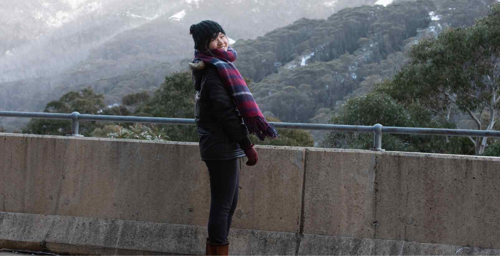 Woman overlooking bridge