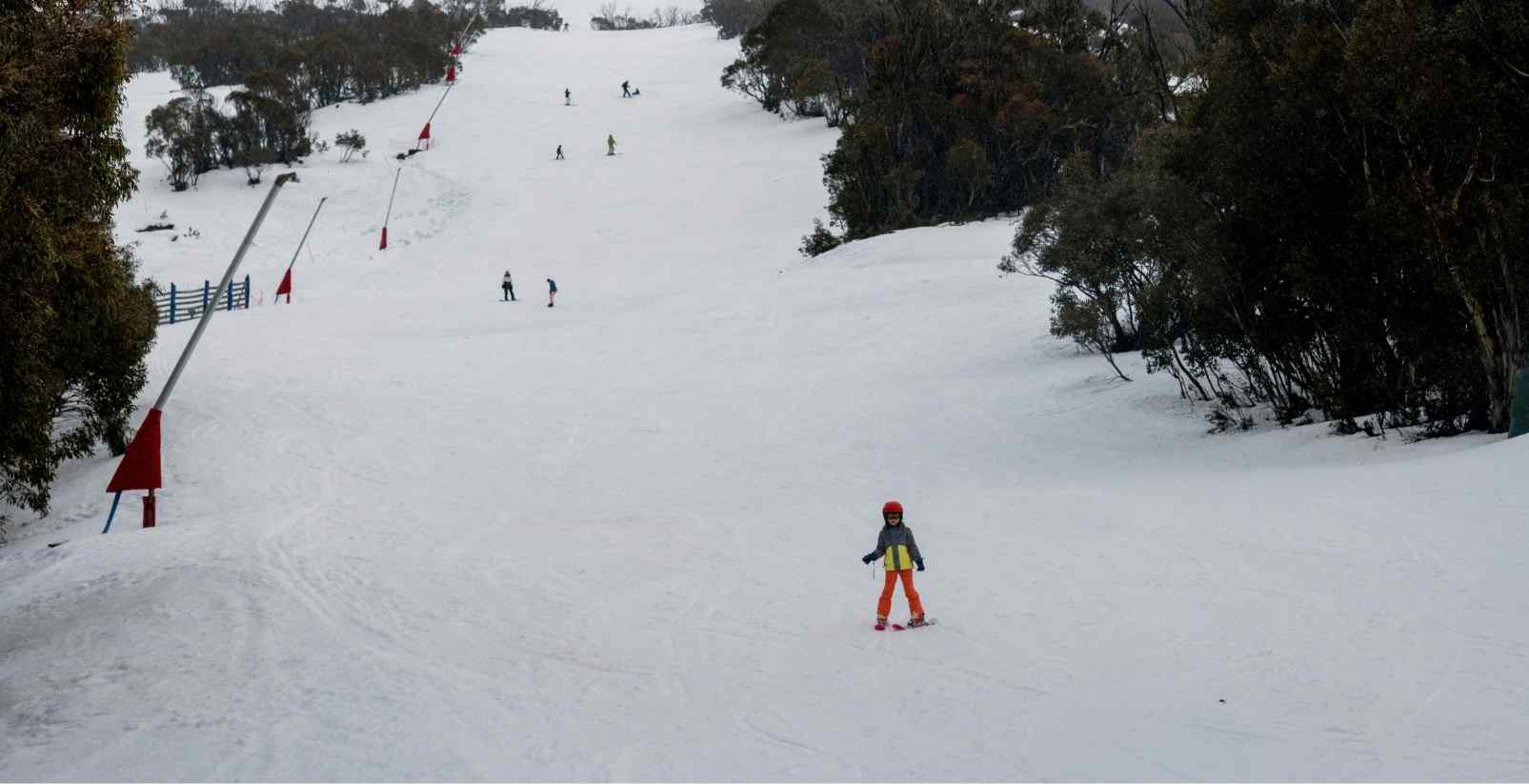 People skiing down hill