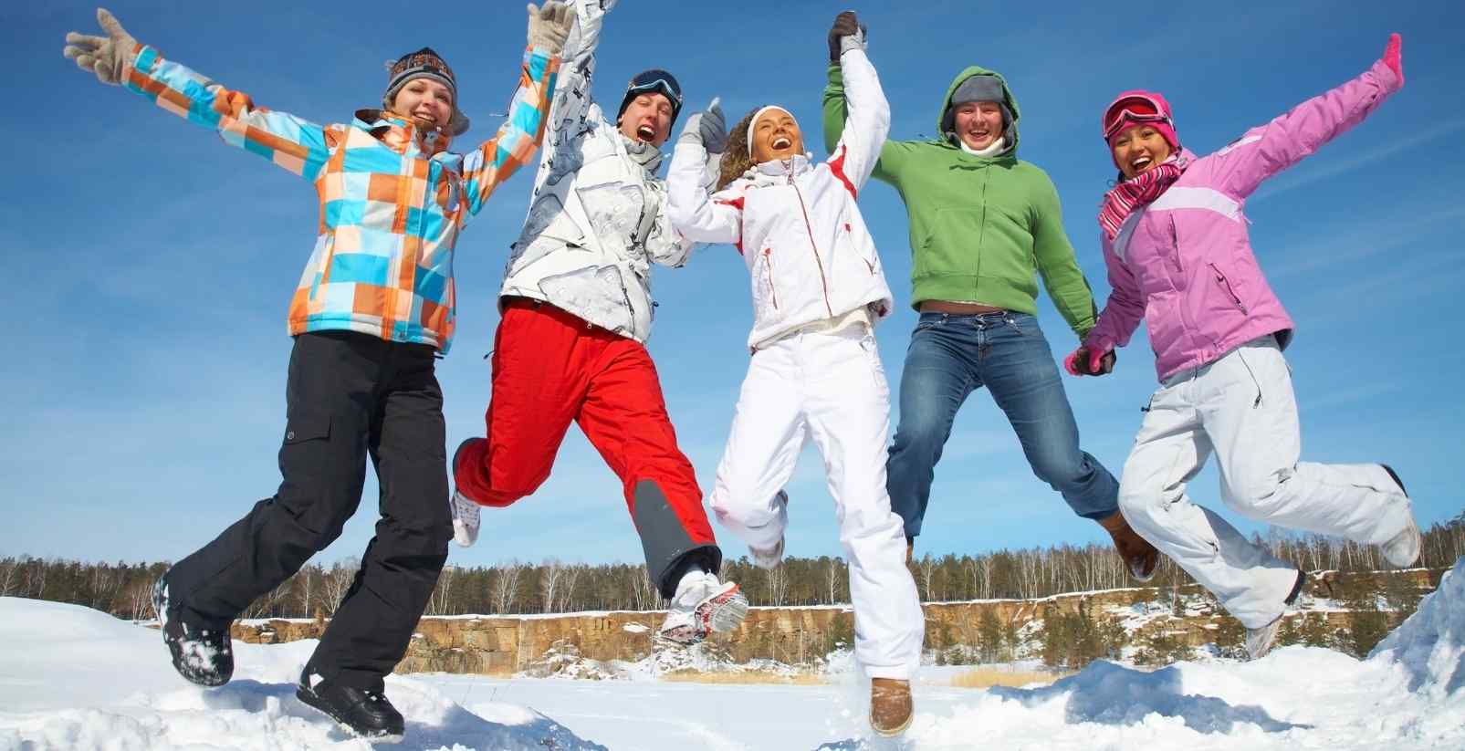 People jumping in the snow